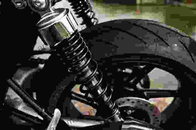 A Motorcycle's Suspension System, Showcasing The Components Responsible For Absorbing Road Irregularities THE ENCYCLOPEDIA OF HIGH PERFOMANCE MOTORCYCLE RIDING TECHNIQUES: With The True Science Behind The Dynamics Of Motorcycle Motion